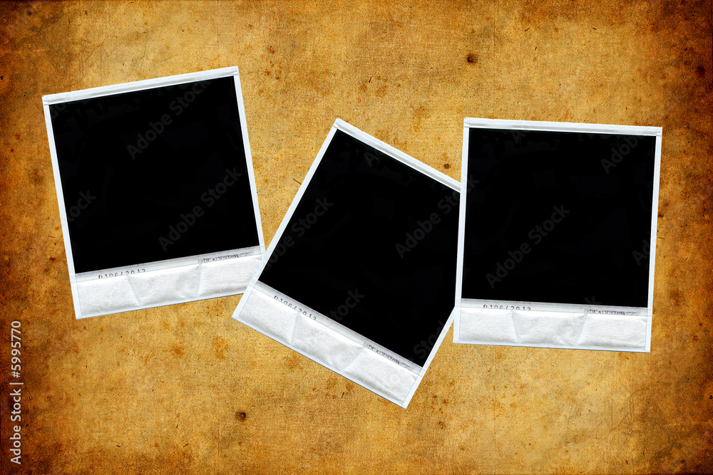 set of three polaroids over old paper texture set of three polaroids over old paper texture
