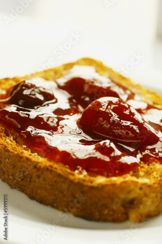 Close up of a toast with strawberry jam