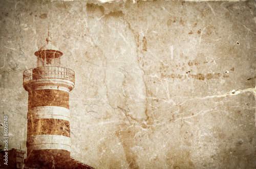 Lighthouse on grunge paper background