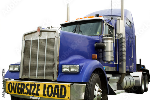 blue truck for oversized load in boatyard isolated on white
