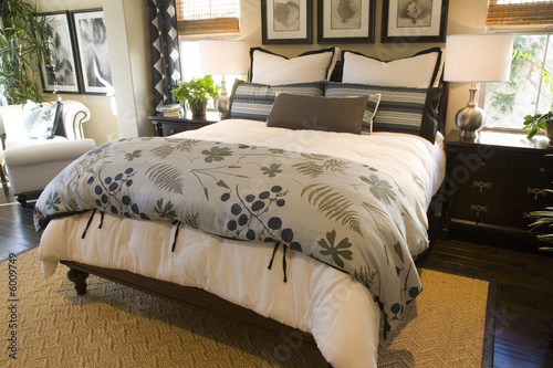 Designer bedroom with contemporary furniture and decor.