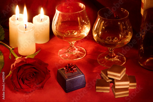 Romantic dinner with rose, candles and gift box
