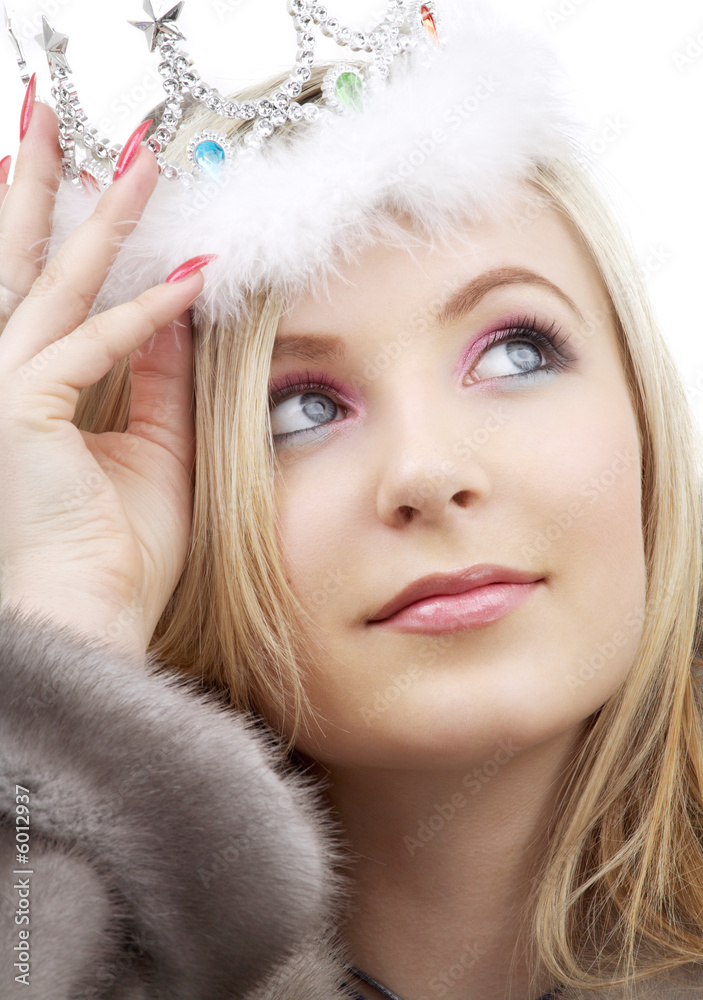 closeup portrait of lovely blond in fur and crown