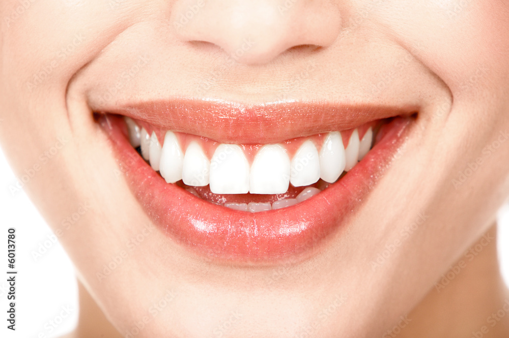 Naklejka premium Beautiful young woman teeth. Isolated over white background.