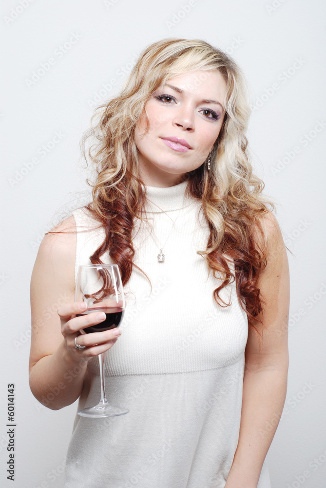 a sexy girl is having a drink and enjoying herself a sexy girl is having a drink and enjoying herself