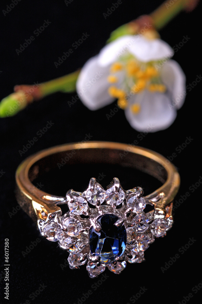 A sparkling diamond and sapphire ring with flower A sparkling diamond and sapphire ring with flower