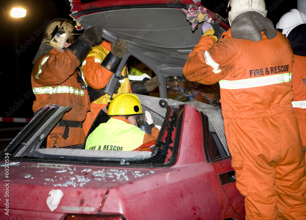 Fototapeta premium firemen taking off the top