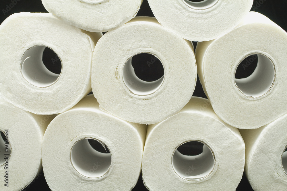 a lot of toilet papers on black background a lot of toilet papers on black background
