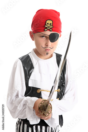 Fotografie Boy pirate wearing patch & bandanna and holding a sword