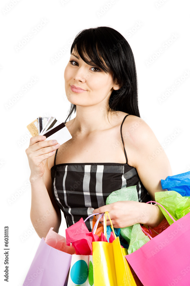 A beautiful woman carrying shopping bags and credit cards A beautiful woman carrying shopping bags and credit cards