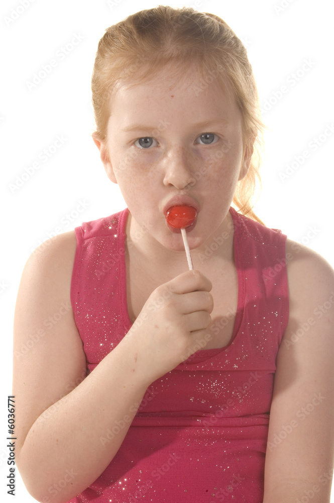 little girl is eating a lollypop little girl is eating a lollypop