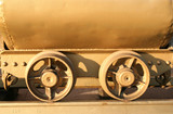 Mining cart wheels, welded to the rail tracks