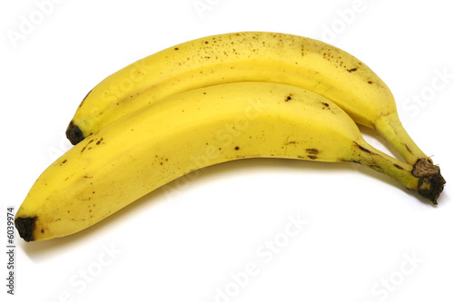 Two ripe bananas on a white background