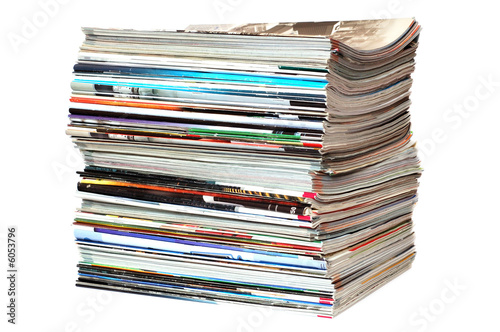 Pile of magazines on white photo