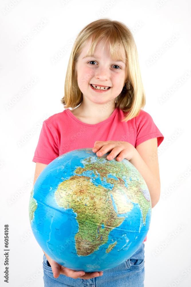 A young girl holding a globe against a white background A young girl holding a globe against a white background