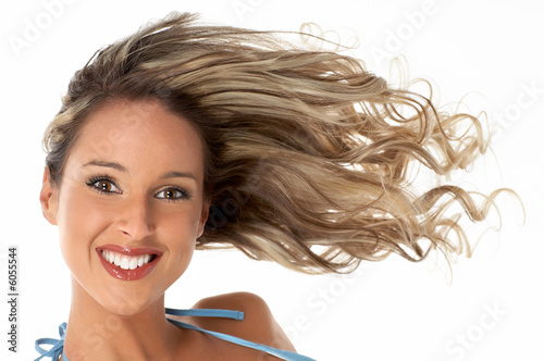 Pretty girl with great fly-away hair. Over white background. photo