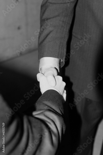 close up of handshake between two businessmen