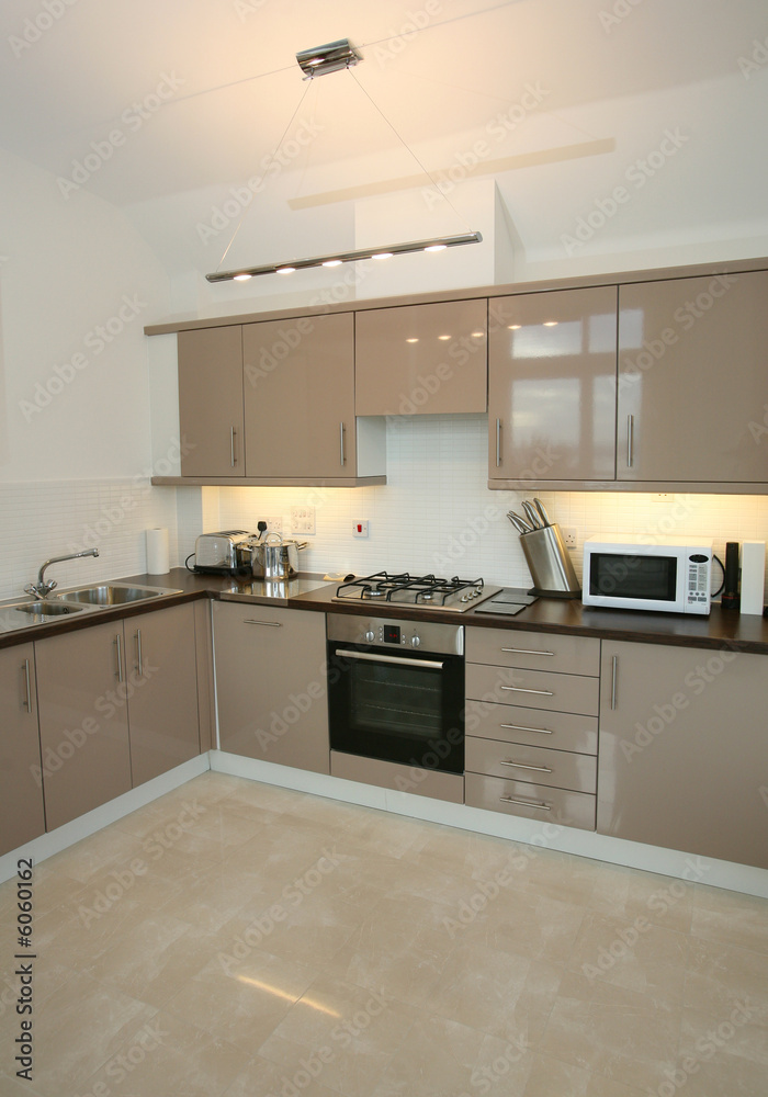 Interior of modern kitchen with integrated appliances Interior of modern kitchen with integrated appliances