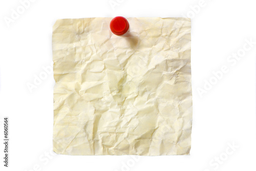 An old dirty post it wrinkled up. Isolated on white photo