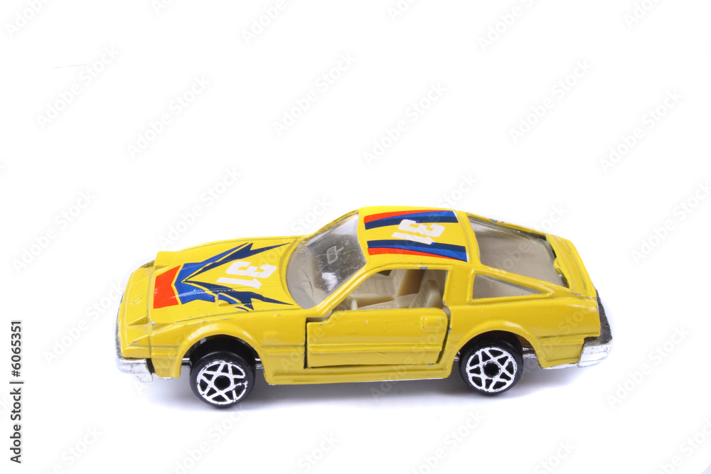 yellow car toy on the white background