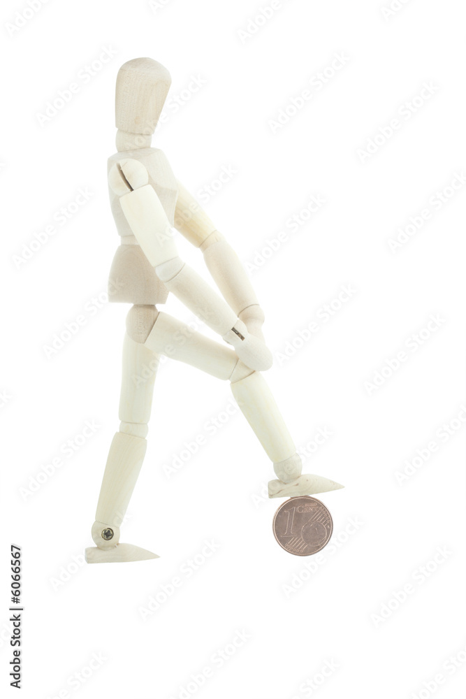 Isolated manikin standing on one cent coin Isolated manikin standing on one cent coin