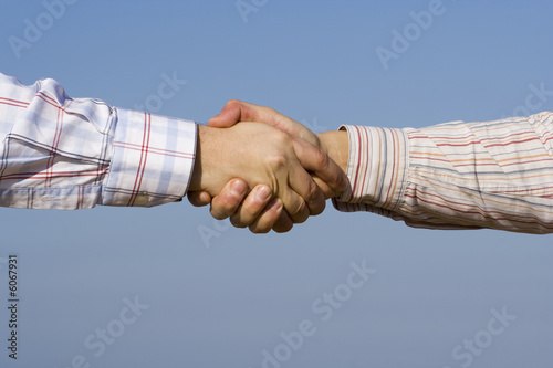two businessman making a deal outdoor