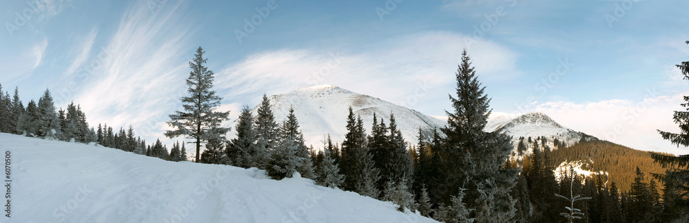 Winter morning mountain landscape with  cirrus clouds 