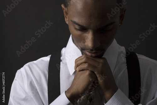 African American businessman is thinking intensely