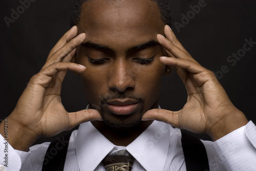 African American businessman is thinking intensely