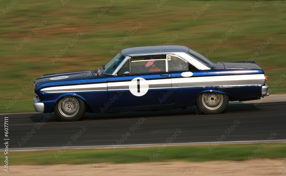 vintage racing car in action on the racetrack.