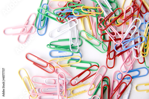 a lot of paper clips isolated on white