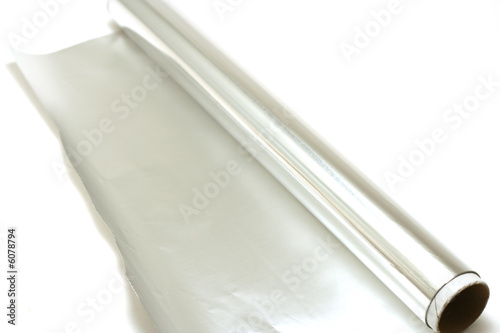 A roll of kitchen foil on a white background