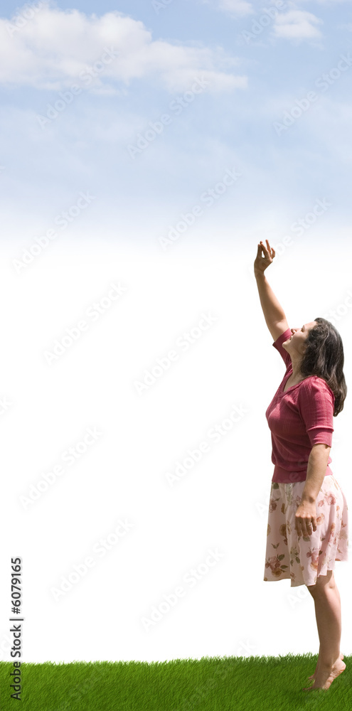 A lady reaching up towards the clouds A lady reaching up towards the clouds