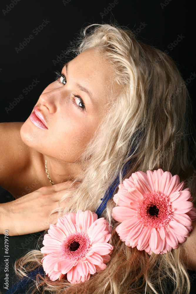 girl and pink gerber around her