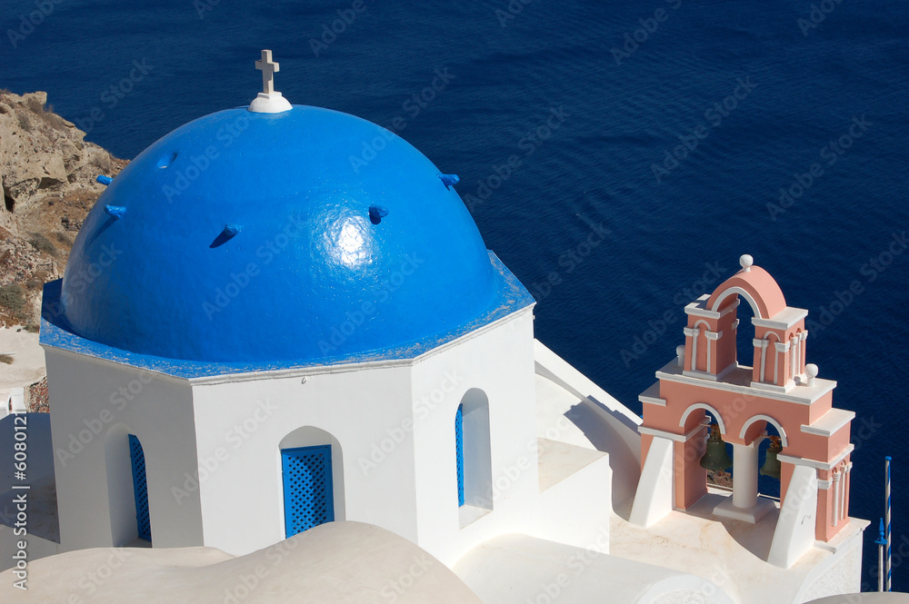 A colorful blue dome in the Santorini cliff town of Oia.