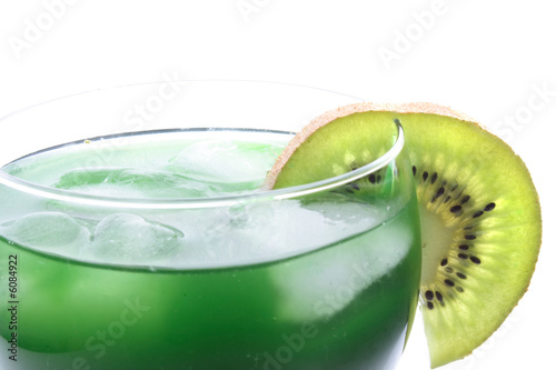 green kiwi drink with slice of kiwi on the white background