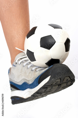 soccer ball on rubber shoes