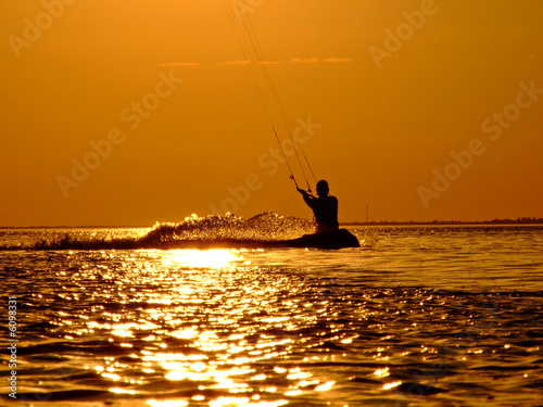 Silhouette of a kite-surf on waves of a gulf on a sunset 2
