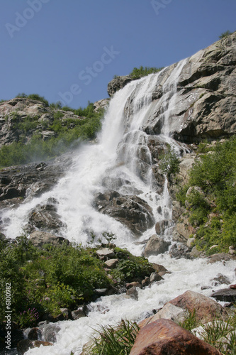 A large waterfall is in mountains