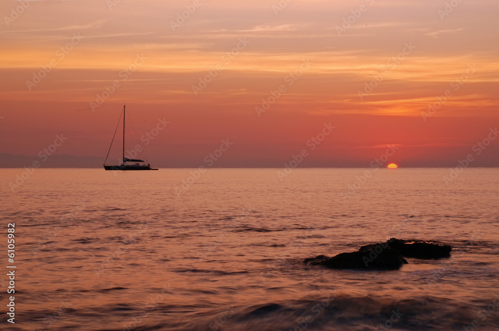 Sailing boat silhouette and sunrise 
