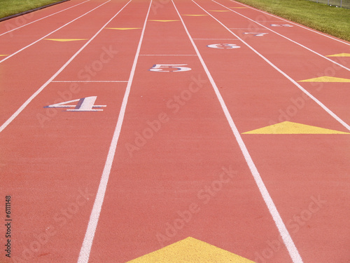 numbered lanes on an outdoor running track © cfarmer