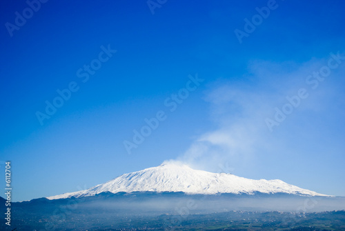 The volcano Etna on a background of the blue sky © ollirg