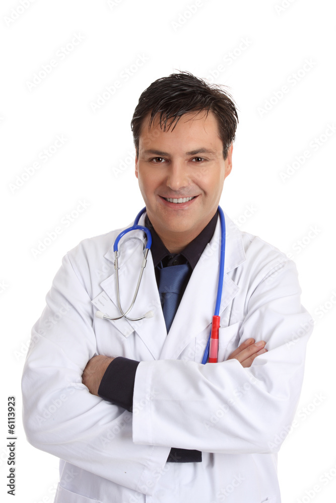 Friendly smiling doctor stands casually with arms crossed Friendly smiling doctor stands casually with arms crossed