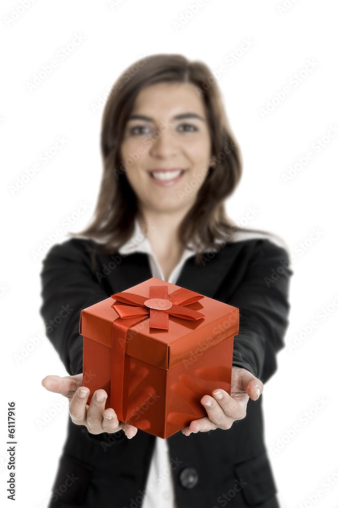 Beautiful bussiness woman holding a gift isolated on white Beautiful bussiness woman holding a gift isolated on white