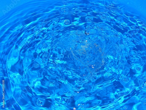 Water rippled in blue plastic container