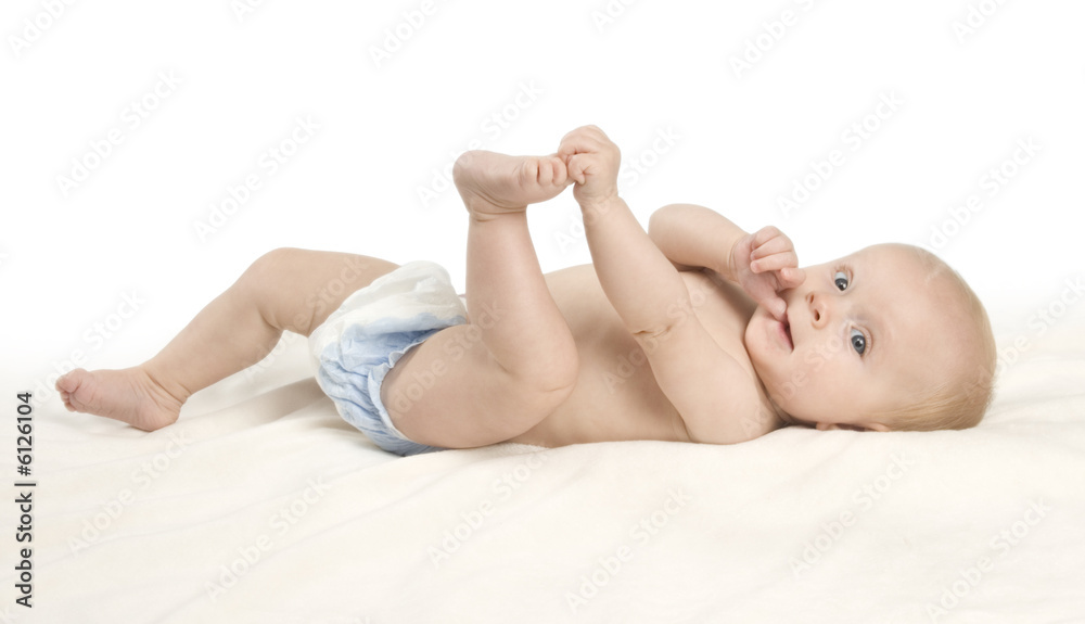 A small baby girl lying on a blanket A small baby girl lying on a blanket