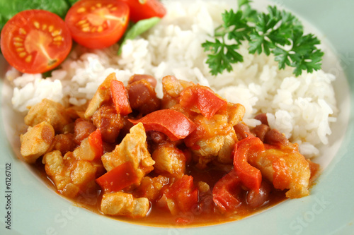 Spicy chicken lentil and pepper stew with rice