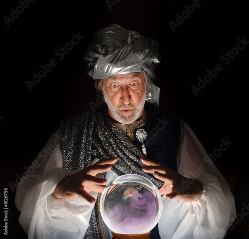 Swami gazing into a crystal ball photo