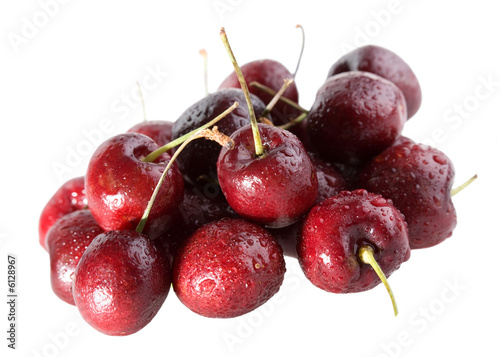 heap of cherry with water drops isolated on white