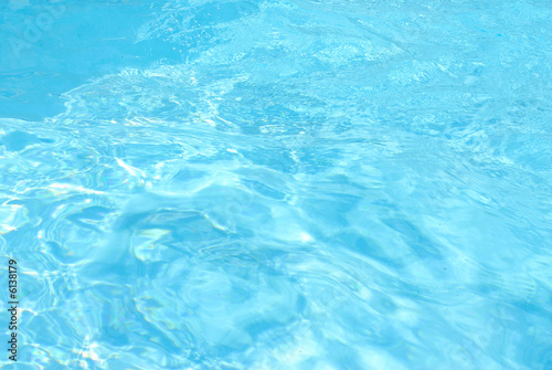 Abstract blue Water of a Swimming Pool .